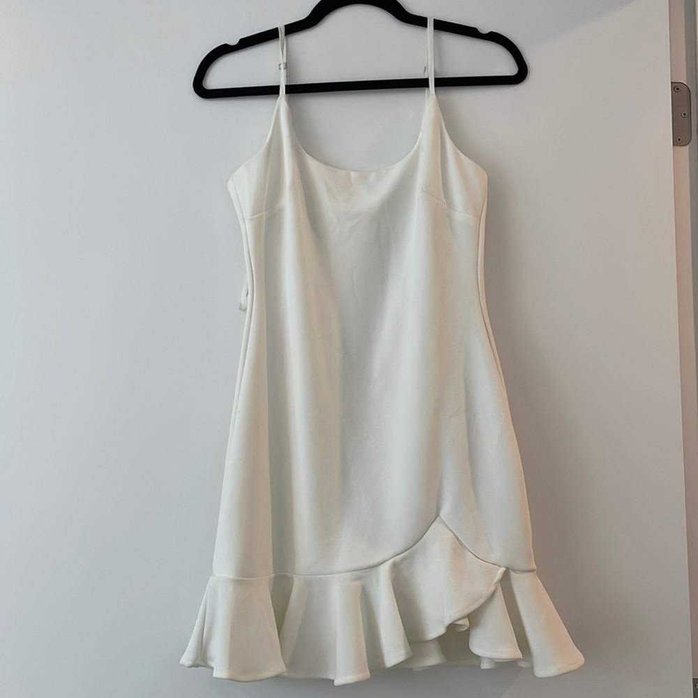 Saints + Secrets brand new white mini dress with bottom ruffle